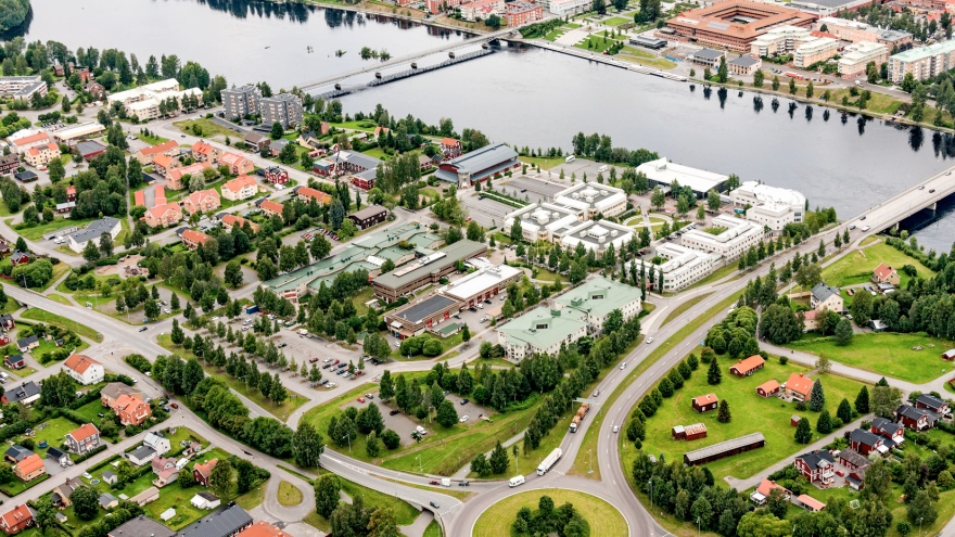 image from above of a city by a river